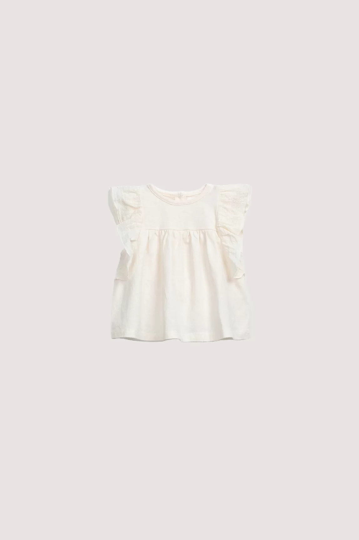 Creme tuniek voor baby's met ruffles bij de mouwen